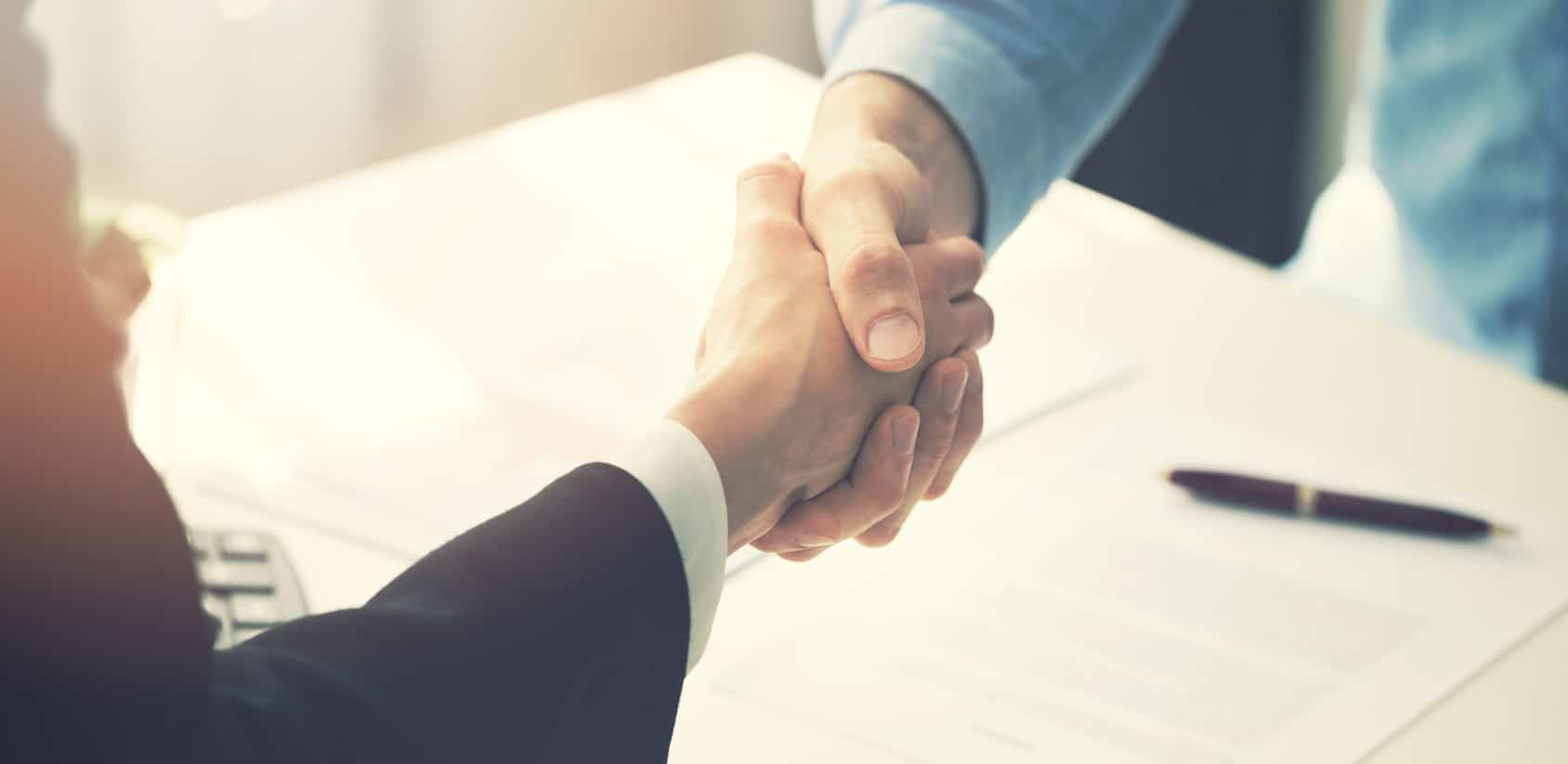 business people handshake after partnership contract signing