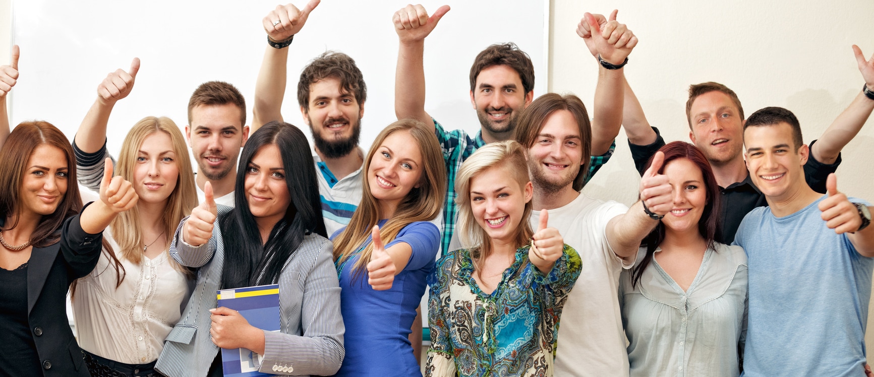 Group of happy students at classroom